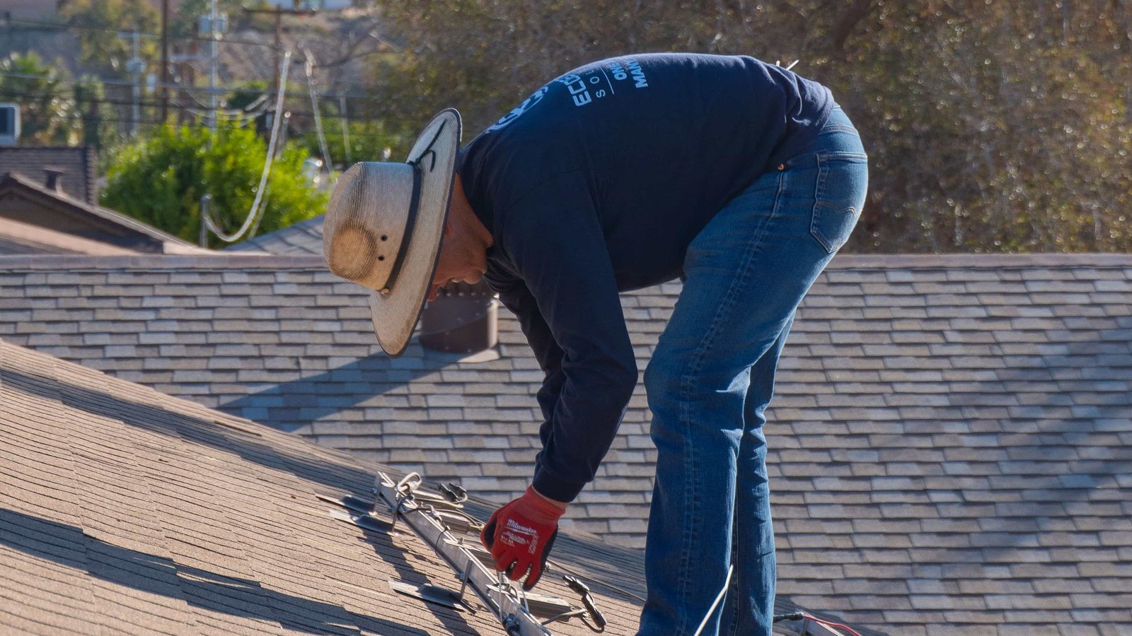 EcoEnergy worker installing rail brackets